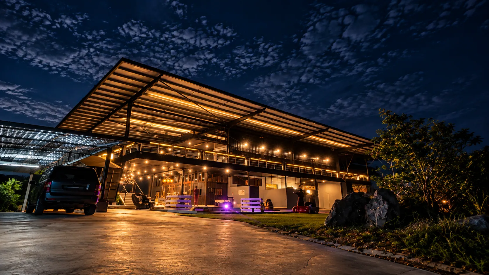 The front of the estate lit up at blue hour