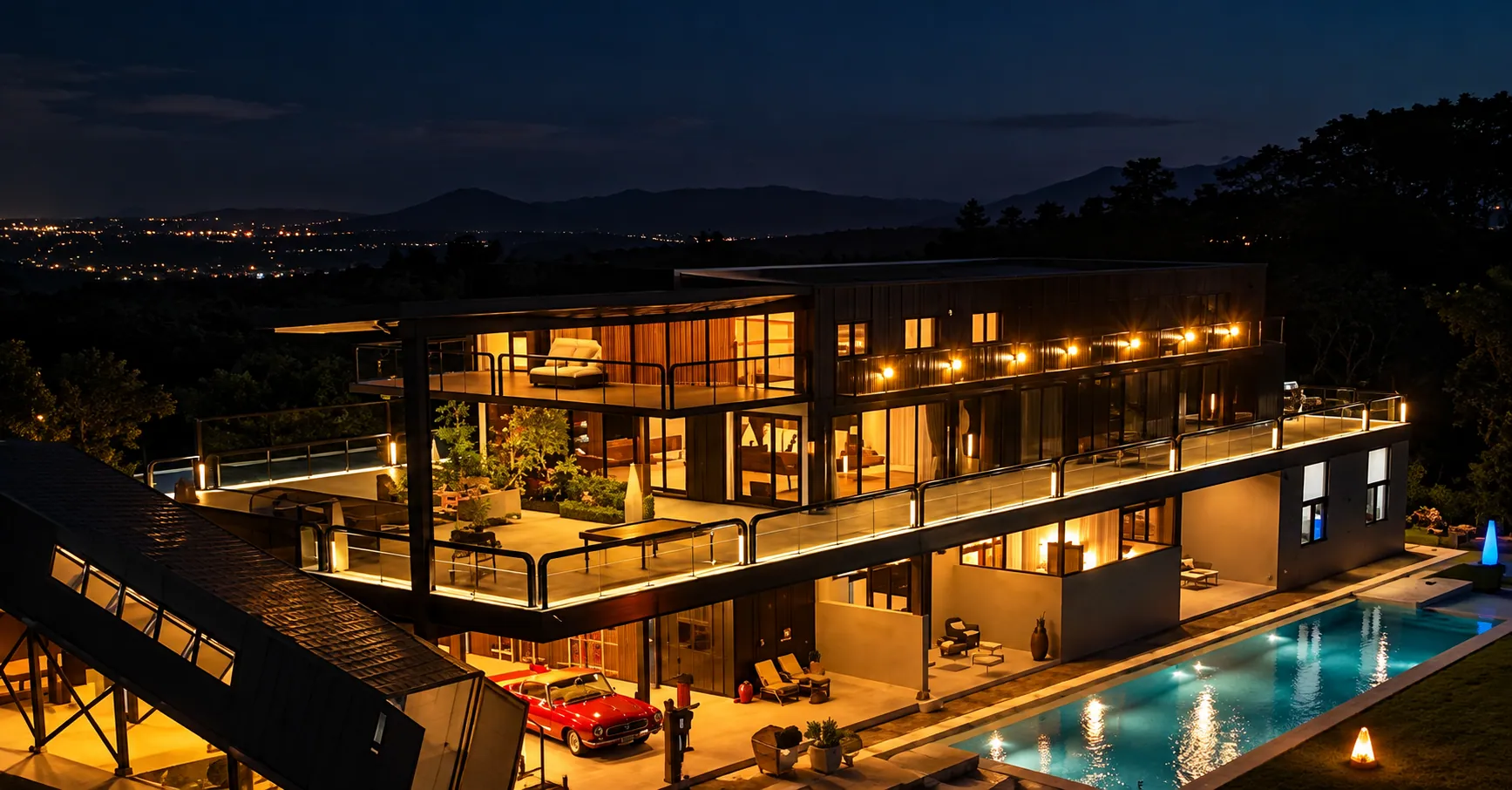 The estate and its pool from above at night