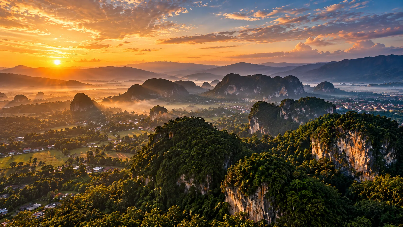 Morning mist across the limestone hills at sunrise